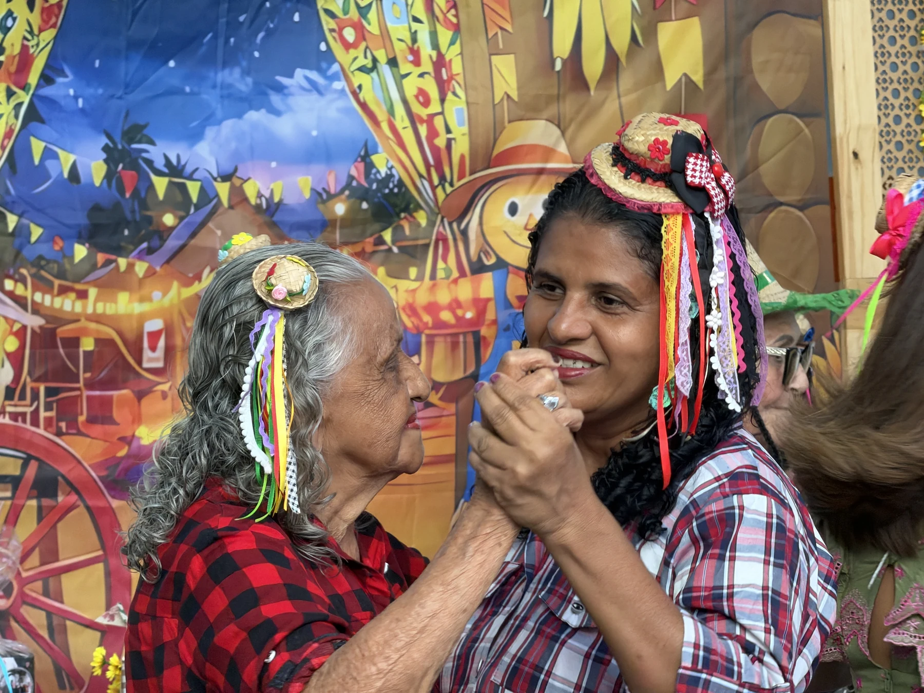 Encontro entre gerações por meio da dança, em um momento de proximidade e partilha na celebração junina · 2026